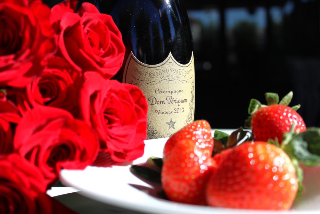 Red roses, Dom Perignon Champagne and a plate of red strawberries for Valentine's Day